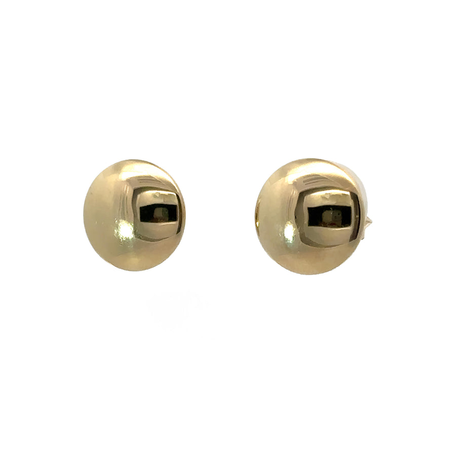 Close-up of classic flat button design in 14k gold studs

