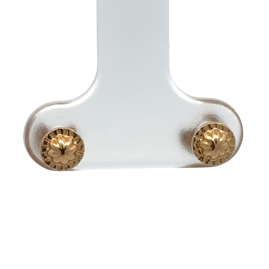Pair of small solid flower earrings in 14k gold