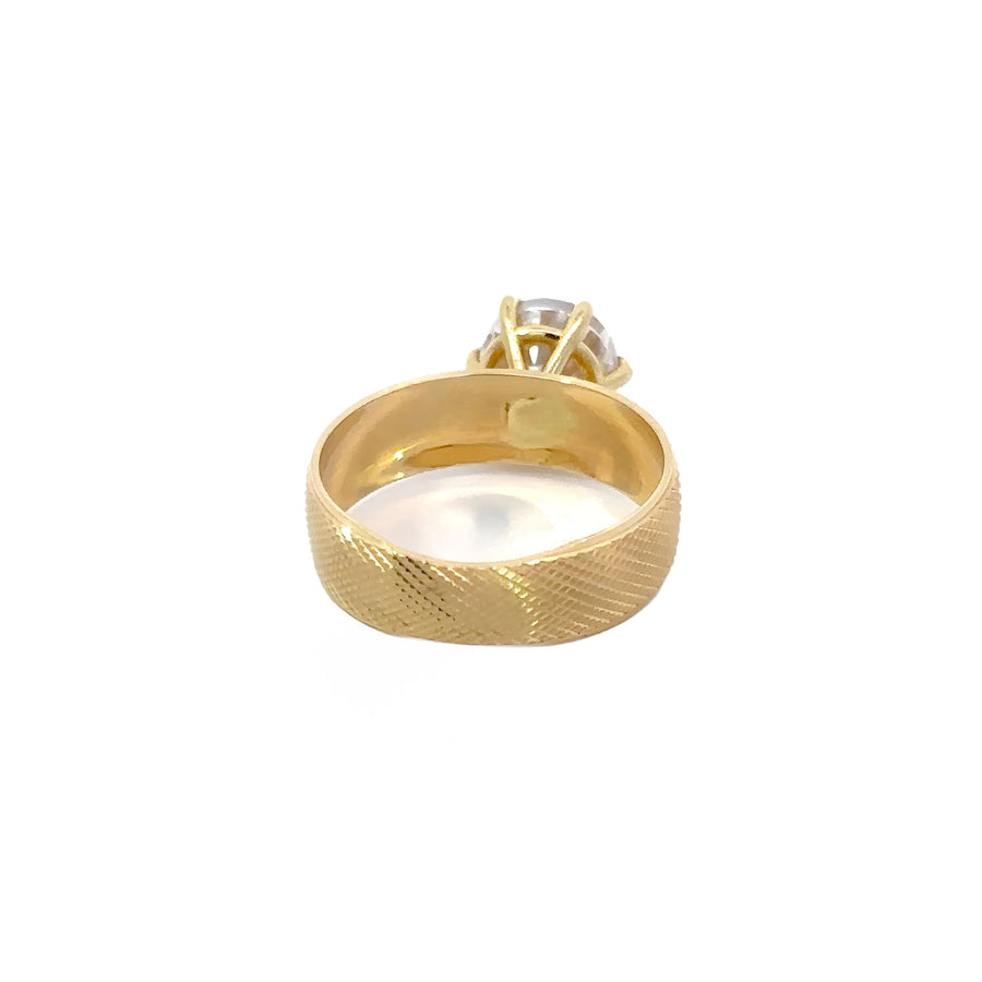 Simple solid gold ring styled for stacking