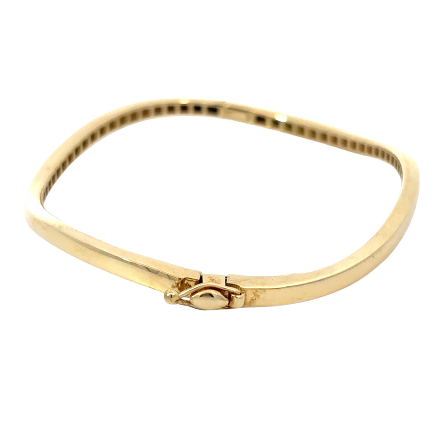 Sculptural 14k gold bracelet with smooth, polished finish