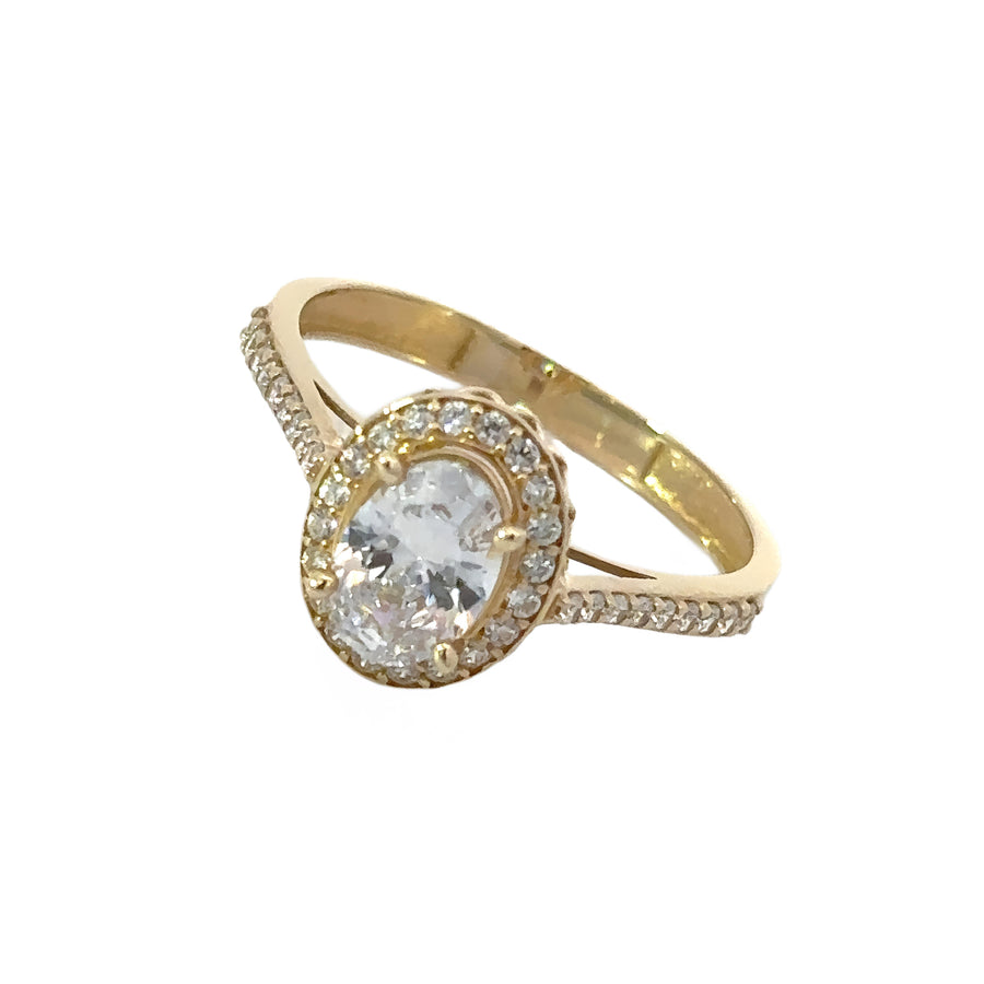Side view of gold solitaire ring with sparkling stone