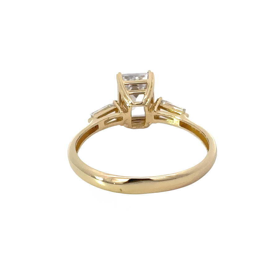 14k gold solitaire ring displayed on white background