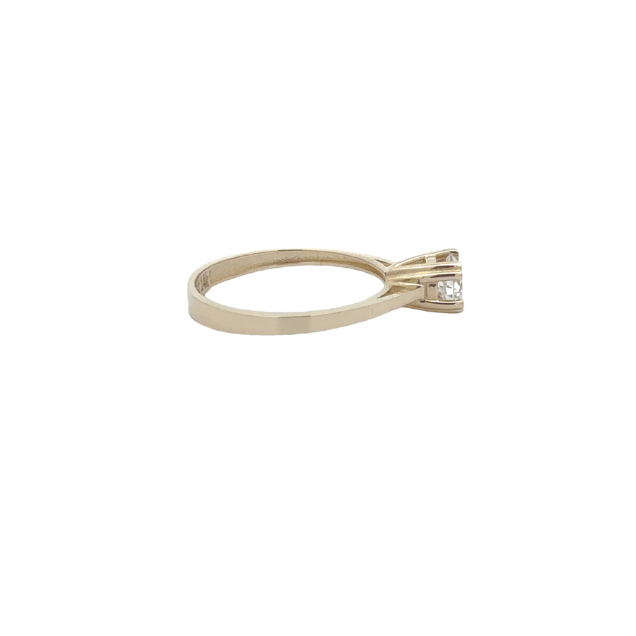 Close-up of small CZ stone in 14k gold solitaire ring