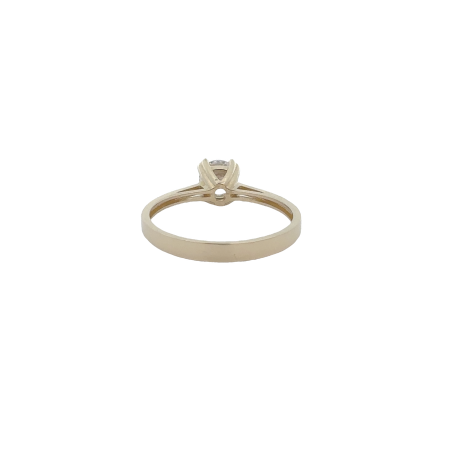 Elegant 14k gold ring featuring a tiny solitaire CZ