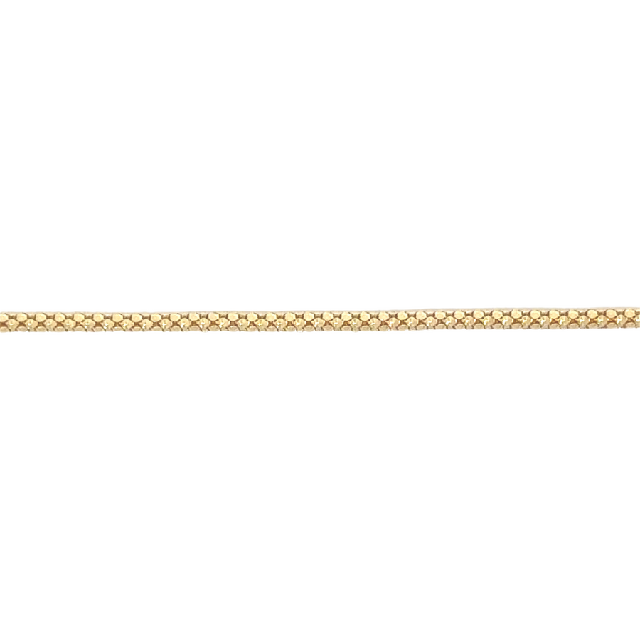 Elegant 14k gold Spiga chain with high-polish finish, perfect for layering