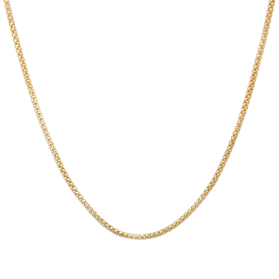 Close-up of a 14k gold Spiga chain, showcasing its detailed wheat link pattern