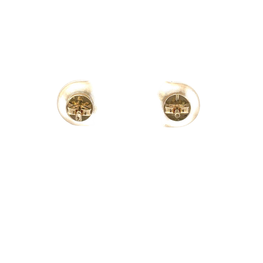Square design ring and earrings laid flat on a soft surface