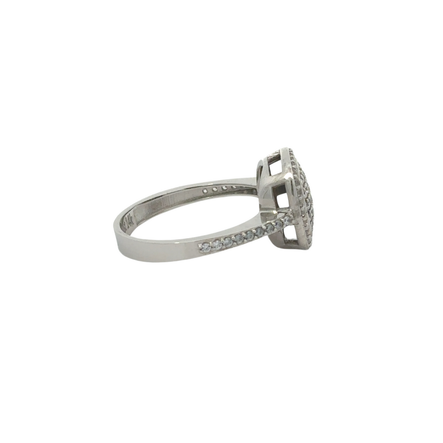 Close-up of bold 14k gold ring with square CZ centerpiece