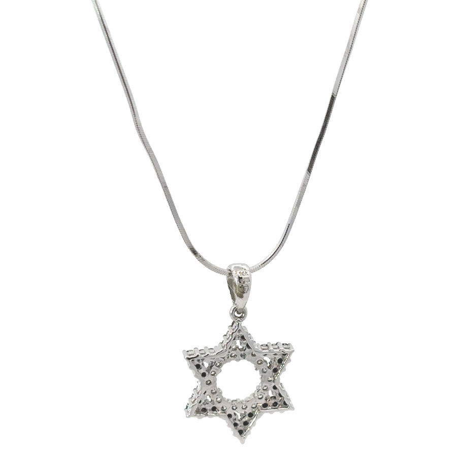 Gold star necklace styled with layered gold chokers