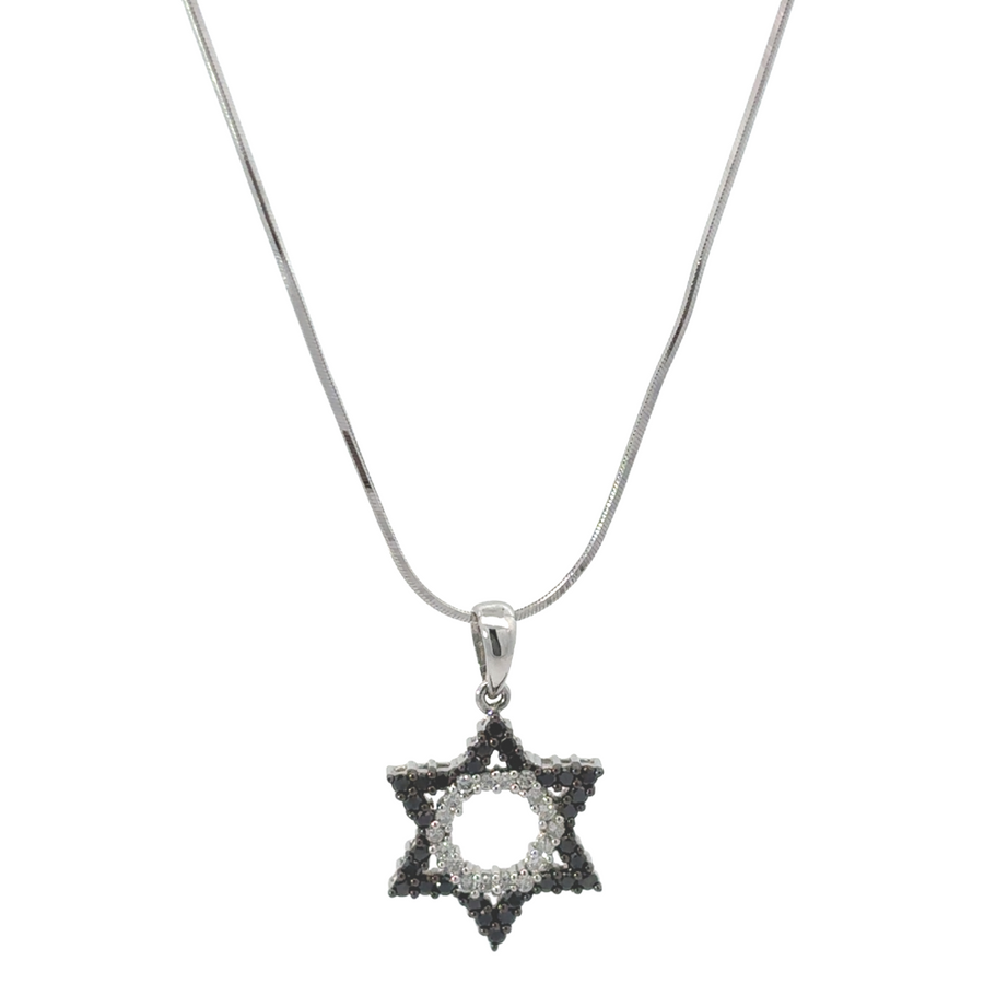 Close-up of 14k gold necklace with dainty star pendant
