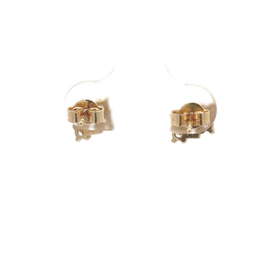 Pair of classic 14k gold CZ studs on white background