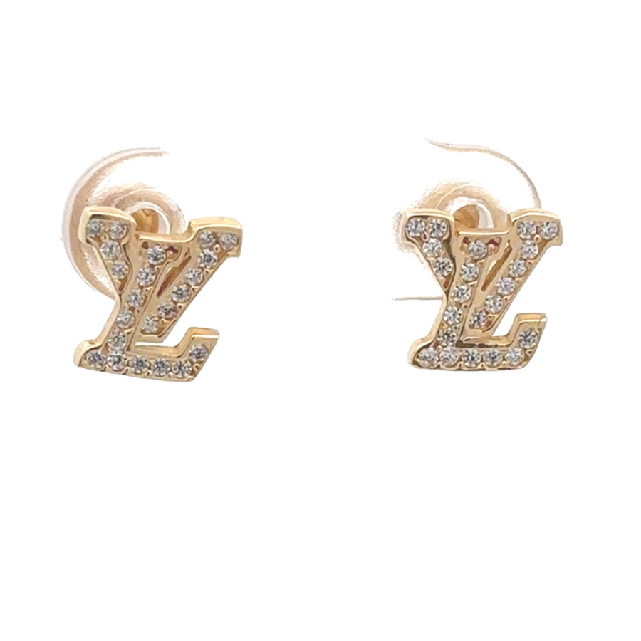 Close-up of 14k gold stud earrings with sparkling CZ stones