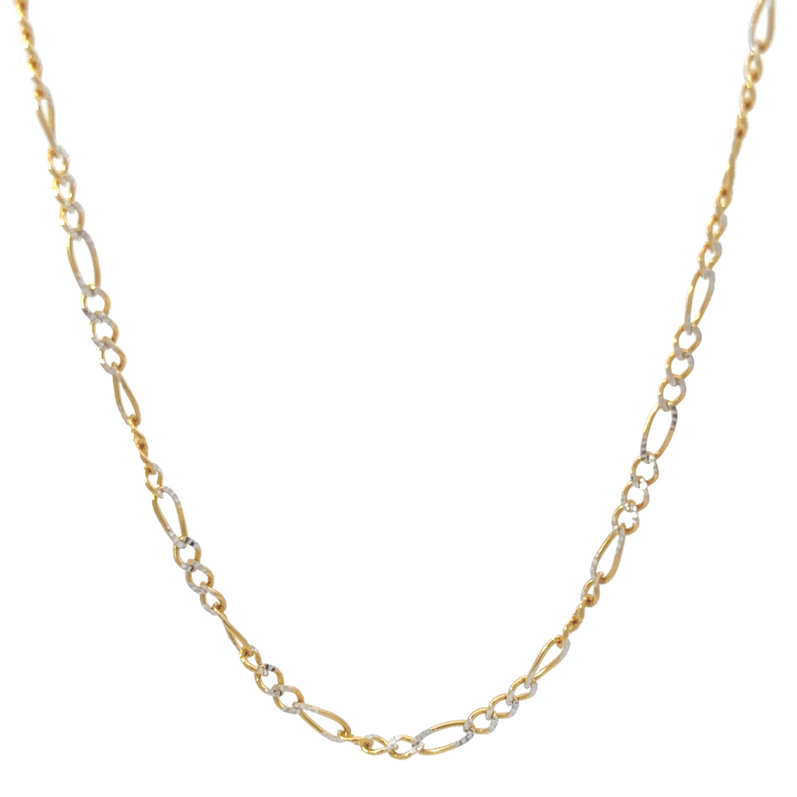 Man wearing 18-inch 14k gold two-tone chain, blending modern edge with classic sophistication.