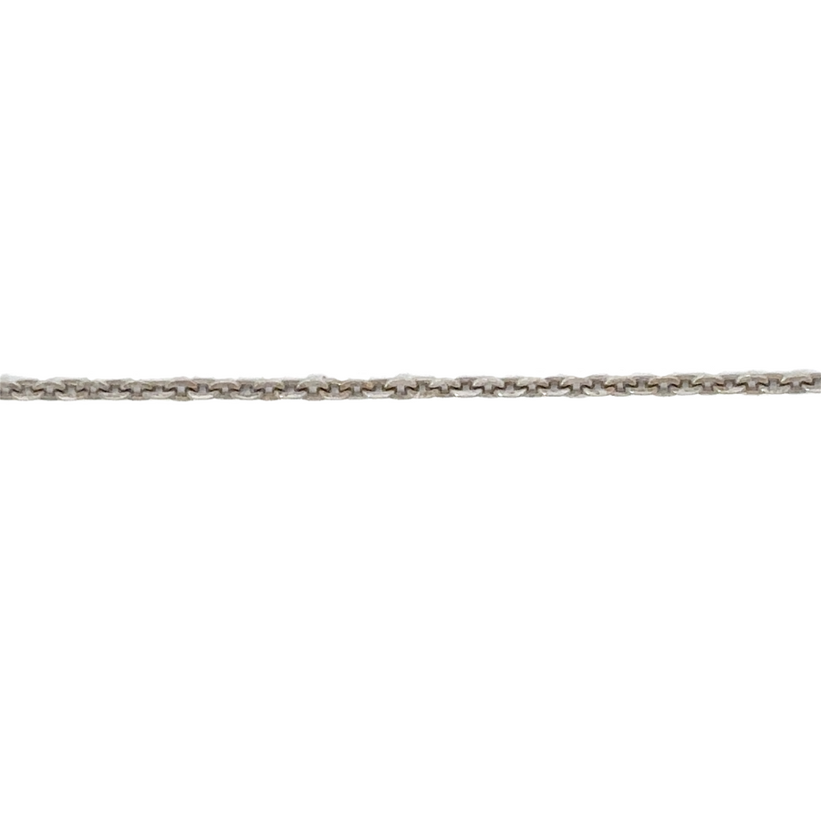 14k gold two-tone chain styled with layered necklaces for a fashionable look