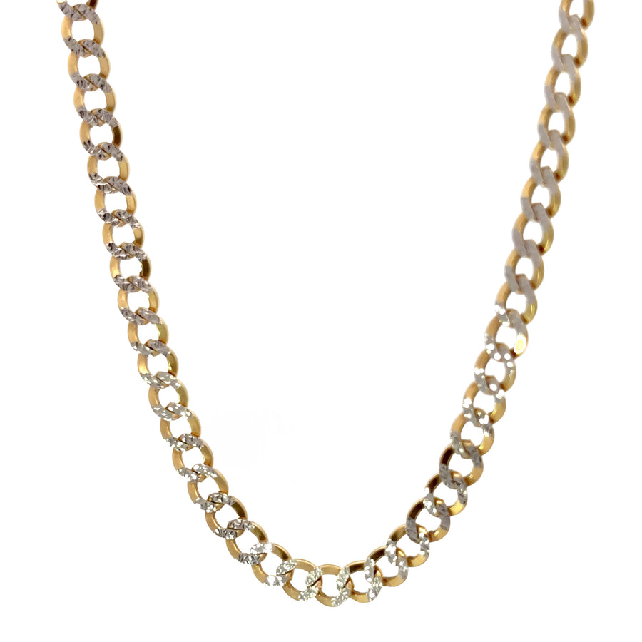 Close-up of two-tone gold links on Cuban chain necklace