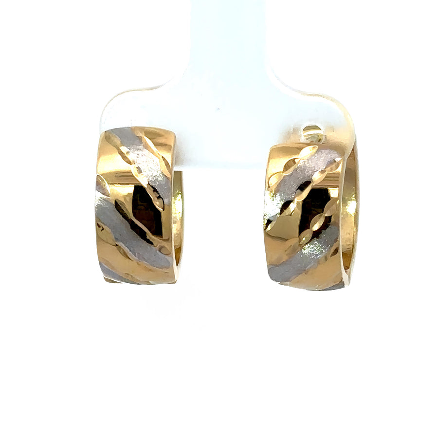 Close-up of 14k gold two-tone line huggies earrings for women