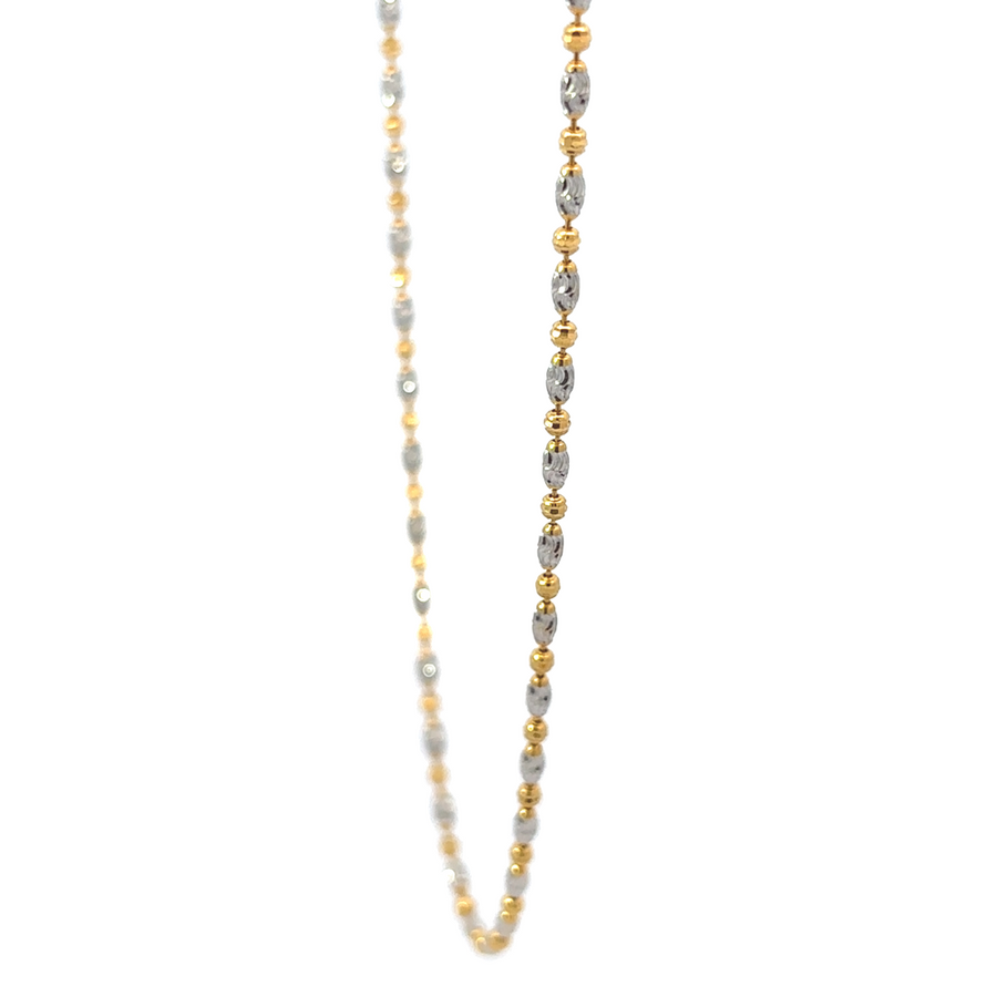 Model wearing the unisex 14k gold necklace, highlighting the necklace’s elegant and modern design