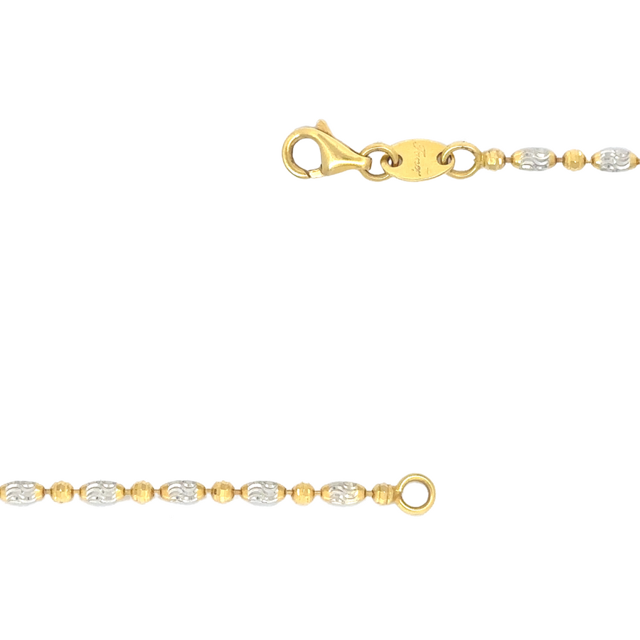 Detailed shot of the necklace’s faceted round and oval links reflecting light beautifully