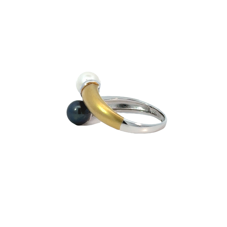 Close-up of 14k gold ring with contrasting gold tones and pearl