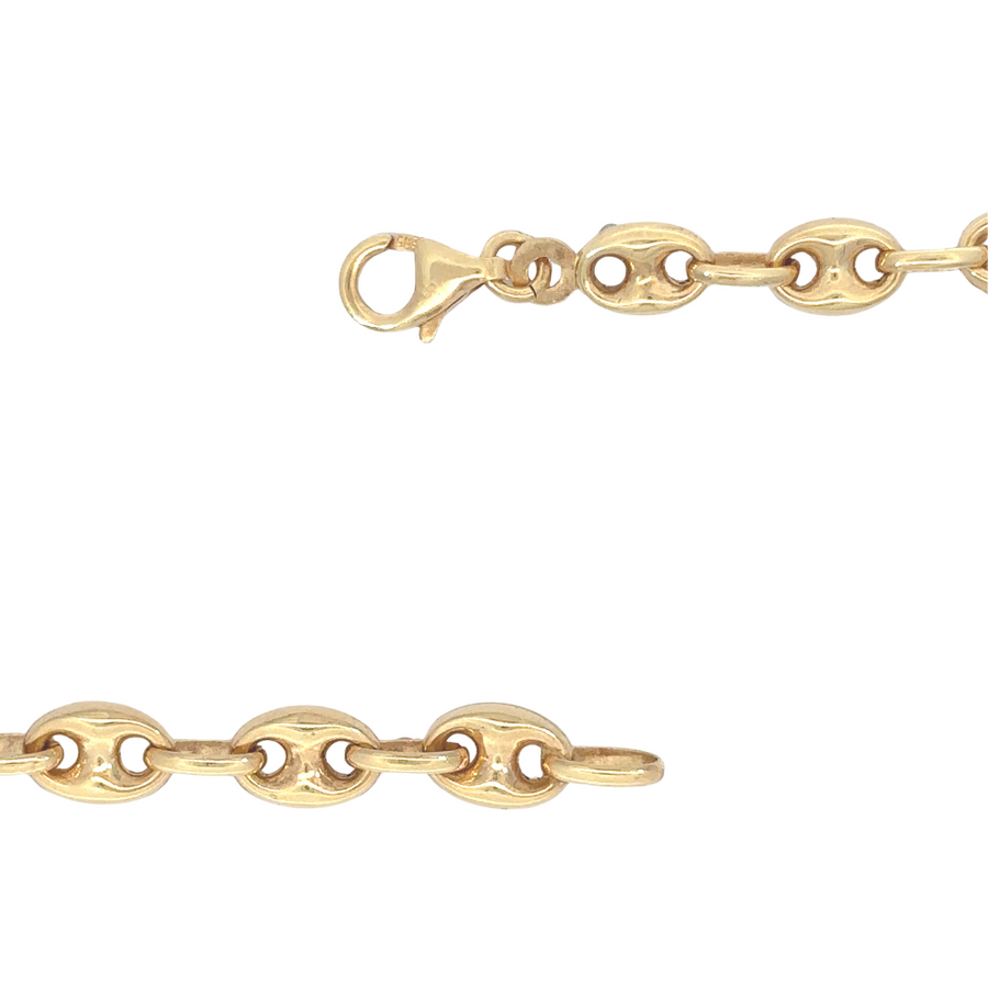 Man and woman wearing the 14k gold bracelet, demonstrating its versatile unisex design