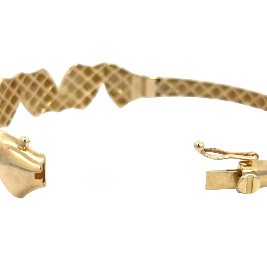 14k gold wide solid bangle with reflective surface