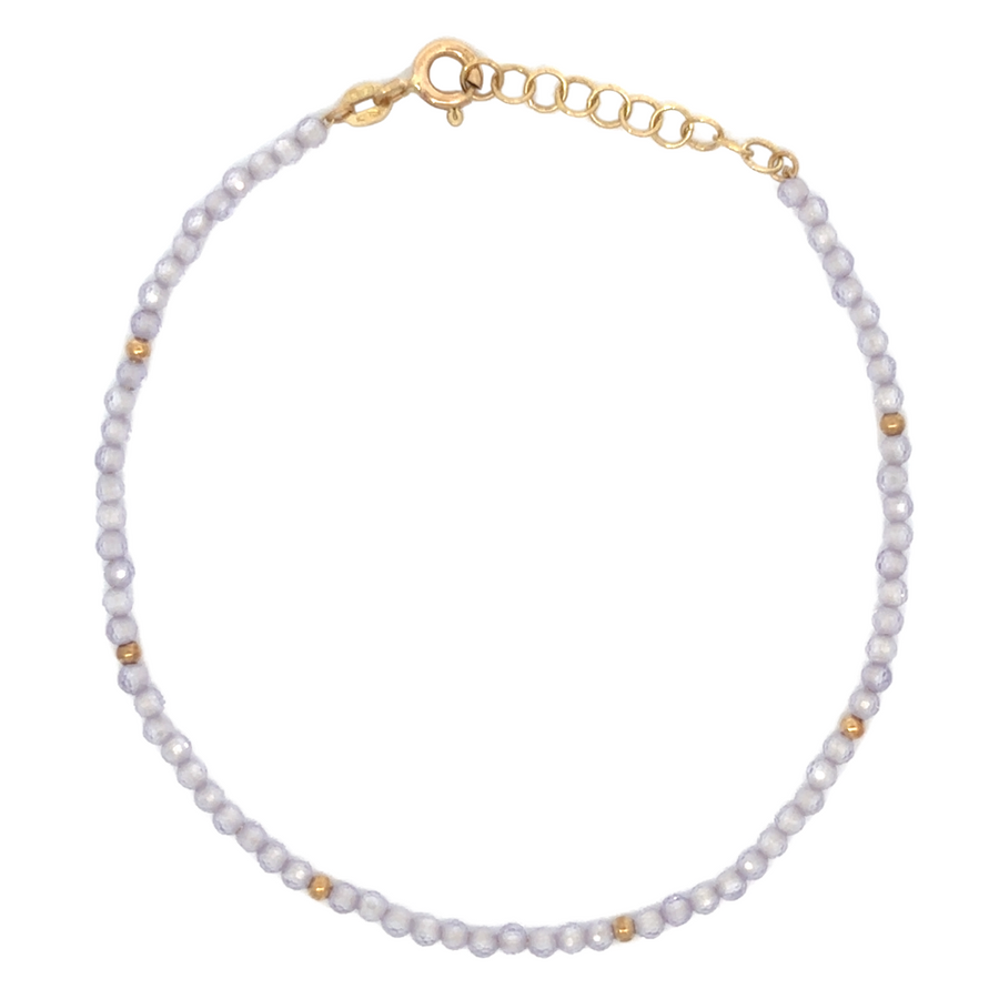14k gold bracelet with lila stones laid flat on white background