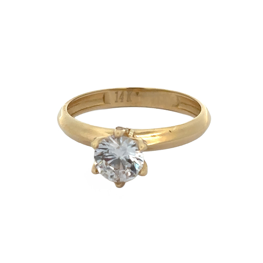 Close-up of sparkling CZ solitaire set in 14k gold band