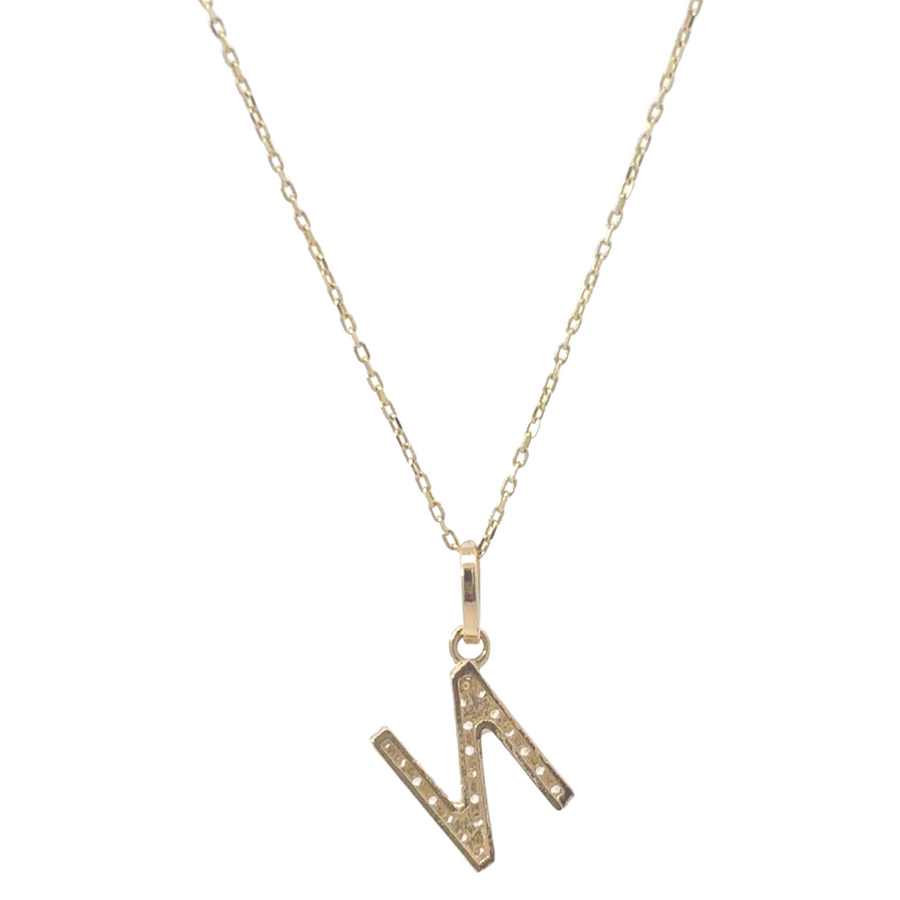 Close-up of 14k gold letter pendant necklace with cubic zirconia (CZ) stones for added sparkle