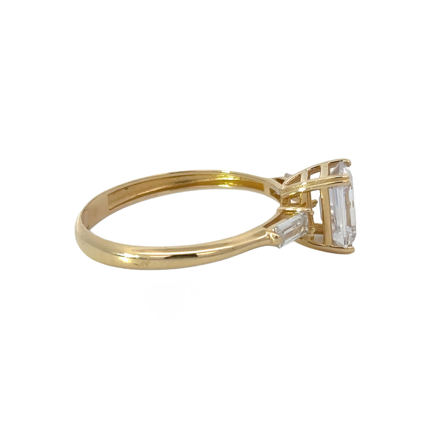 Woman wearing simple 14k gold band ring