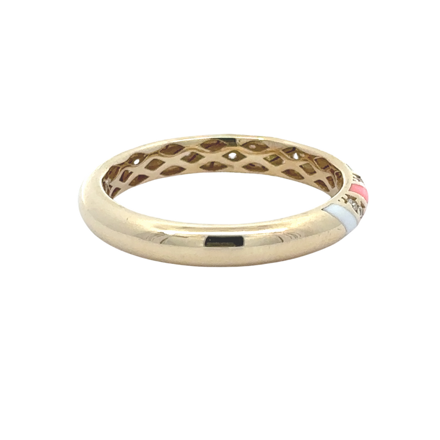 Polished gold ring placed on a marble surface for flat-lay styling