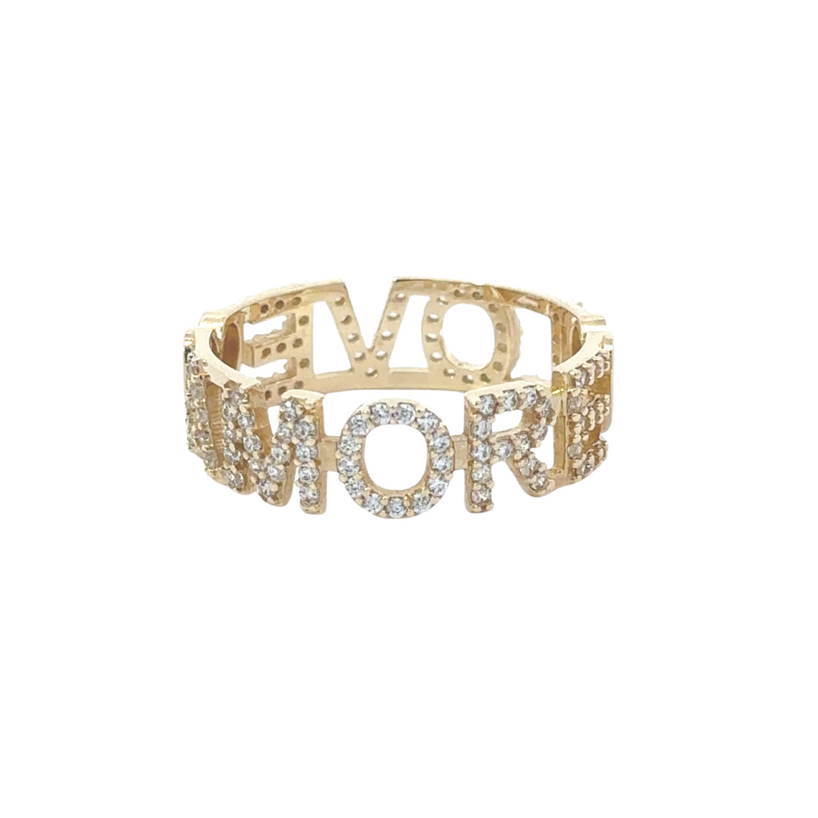 4k gold ring placed on a jewelry tray with other gold accessories