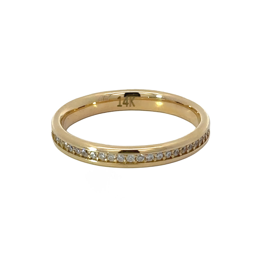 Close-up of sparkling cubic zirconia on 14k gold women’s ring