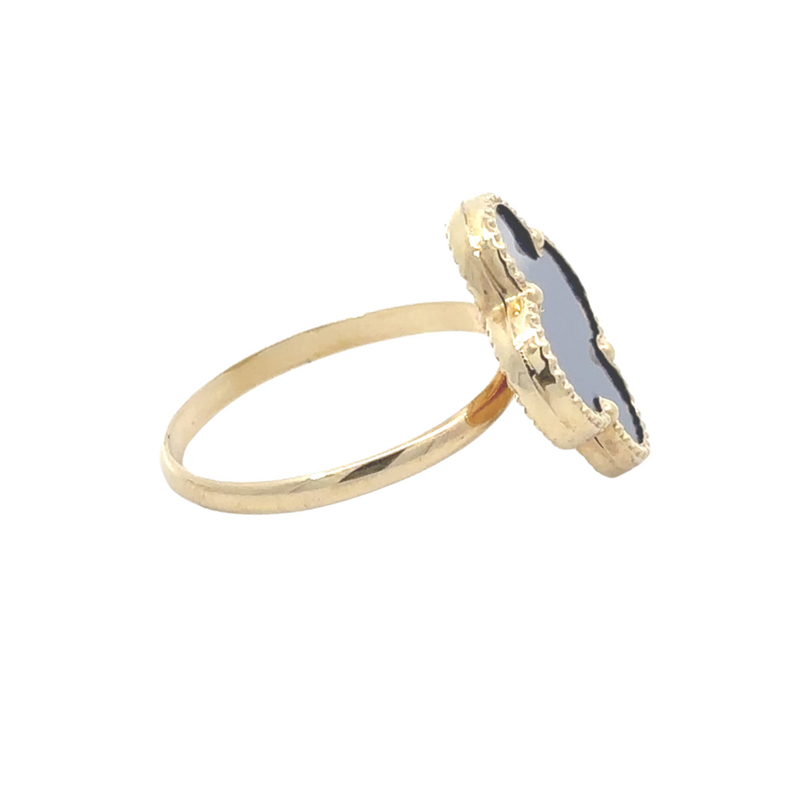 Detail view of blue center stone set in 14k gold women's ring, timeless design