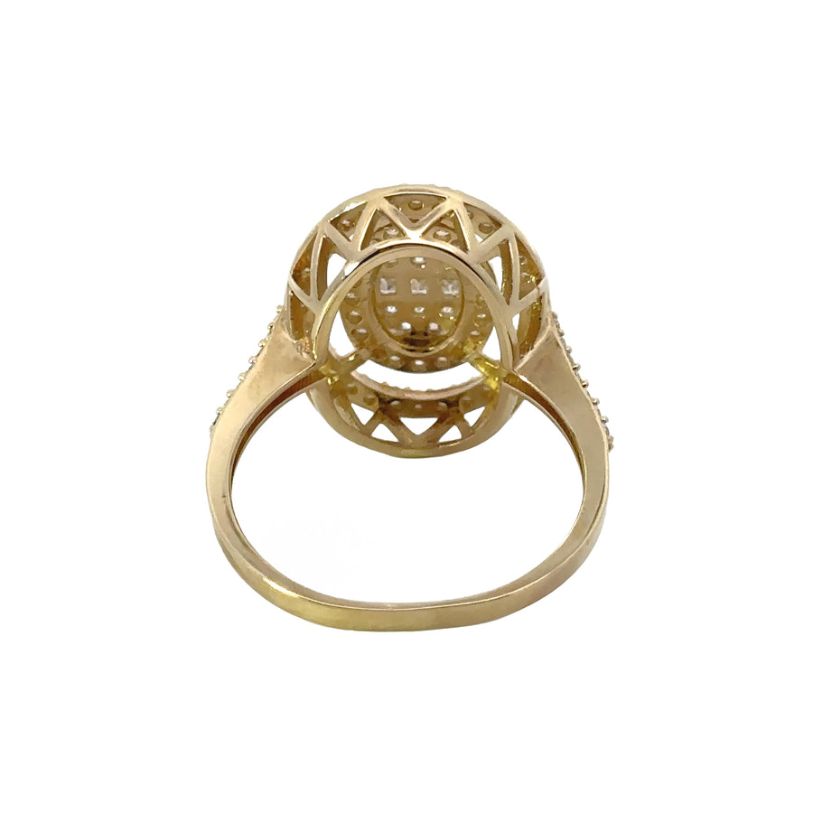Woman wearing 14k gold solitaire ring with minimalist design