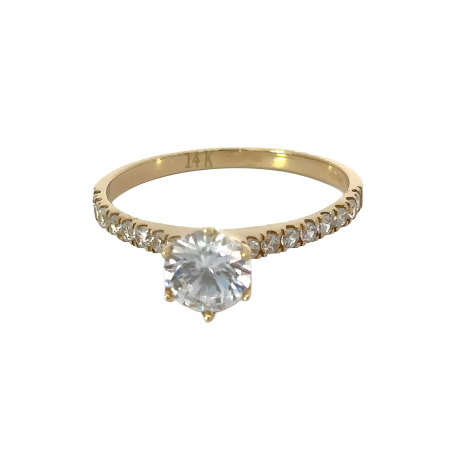 Close-up of elegant 14k gold solitaire ring on white background