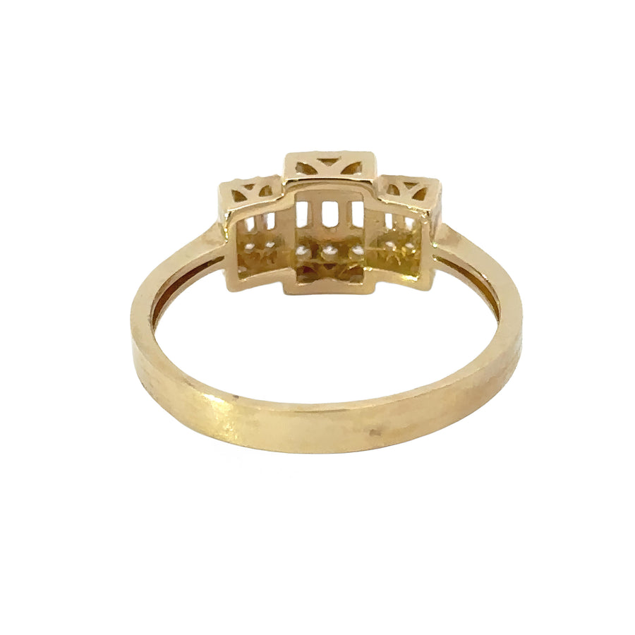 Woman wearing 14k gold solitaire ring with minimalist design