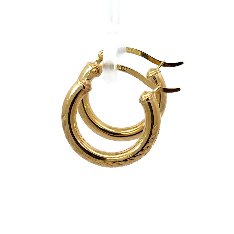 Extra-small 14k gold huggies with sparkling faceted design