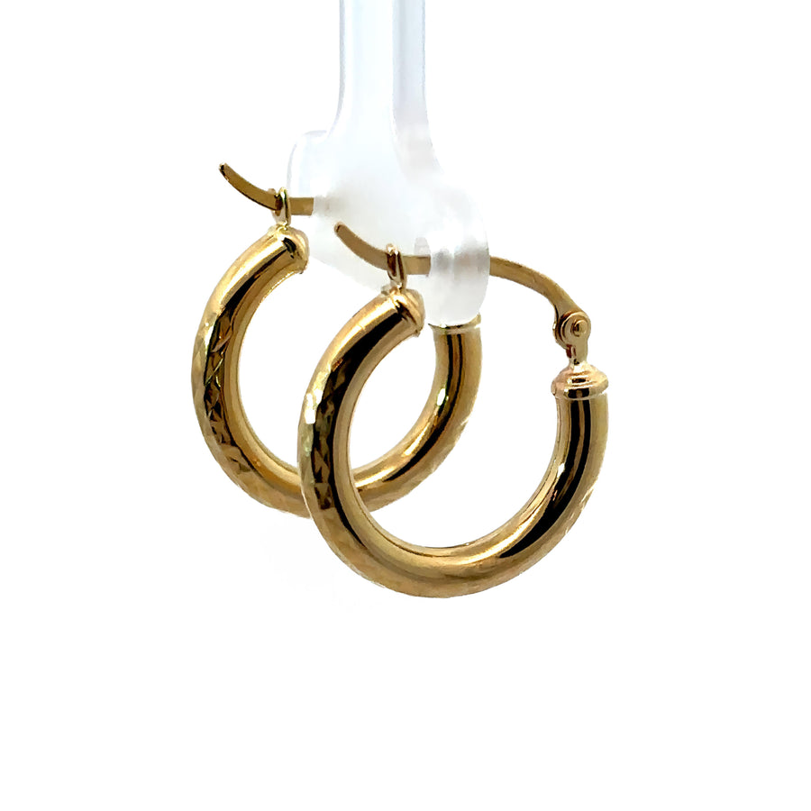 Pair of delicate 14k gold faceted huggies earrings in XS size