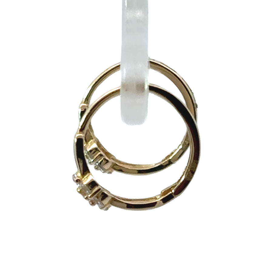 Close-up of baby earrings with tiny flower motif