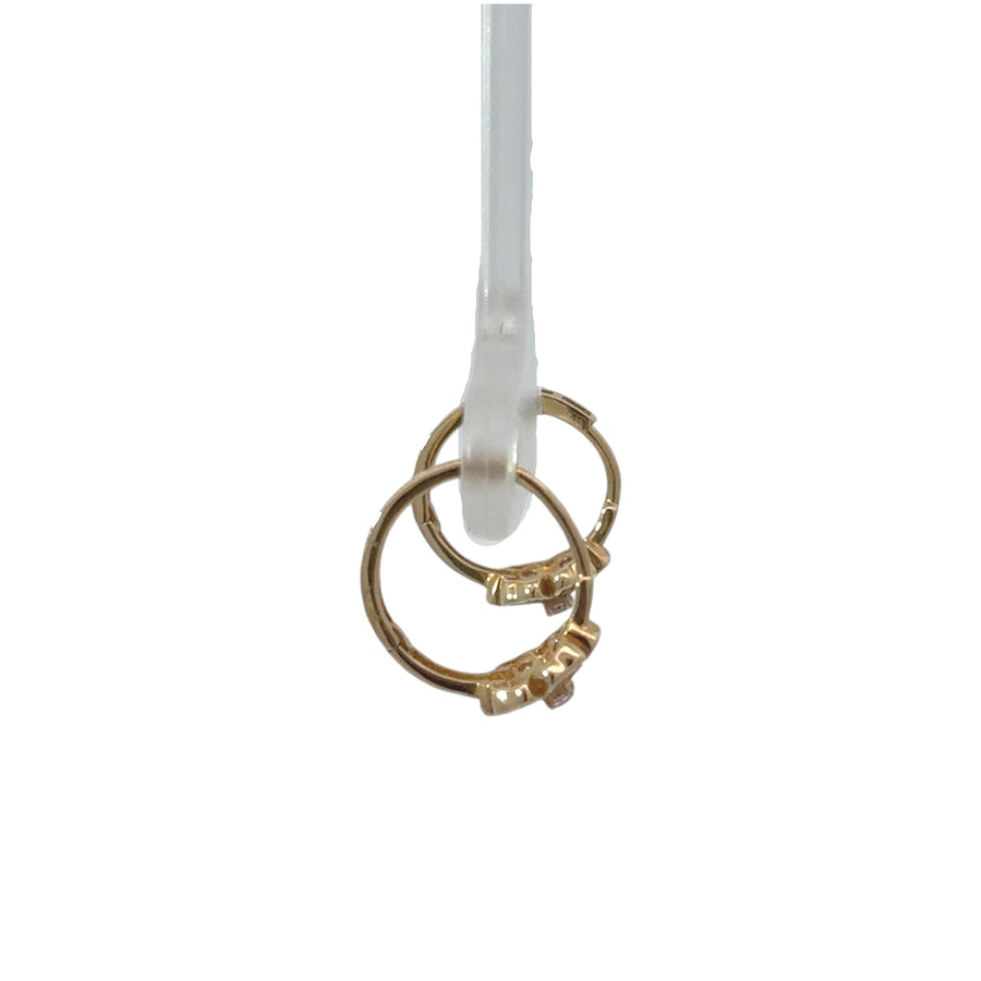 14k gold baby huggie earrings with delicate flower detail