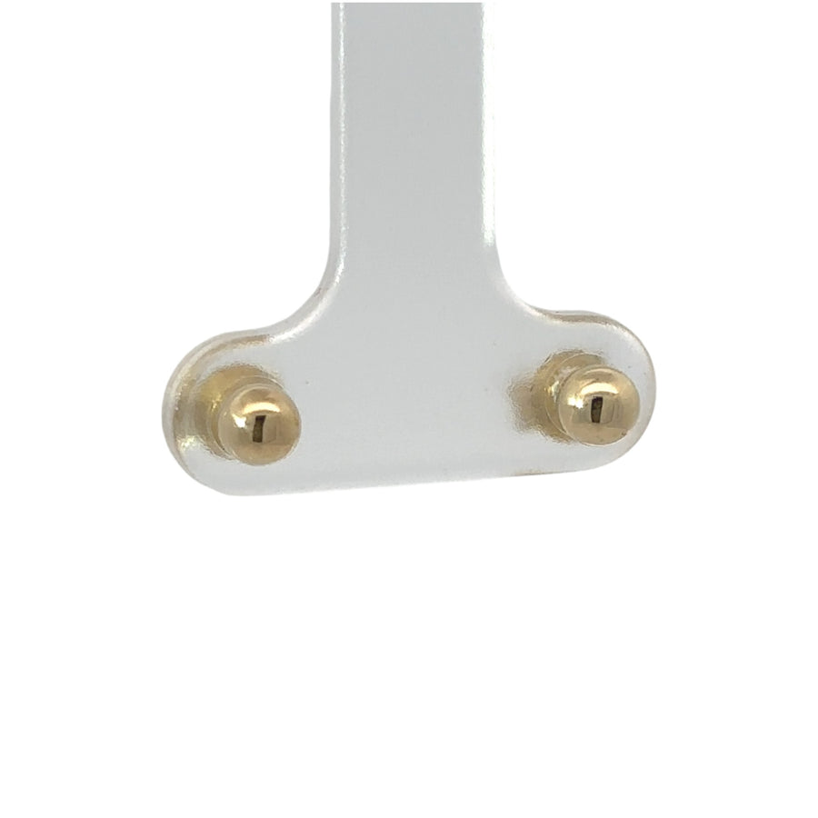 Close-up of solid 14k gold stud earrings for women