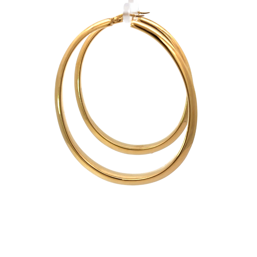 Close-up of polished 14k gold surface on oval earrings