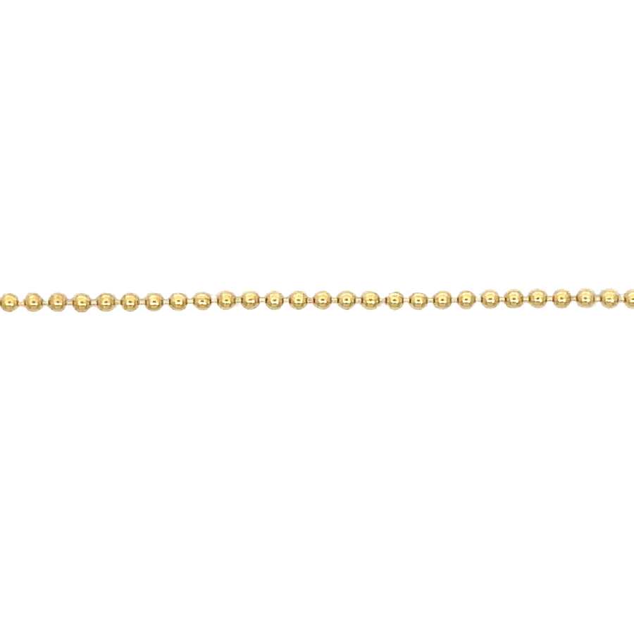 14k gold XXS ball chain necklace draped over a jewelry stand