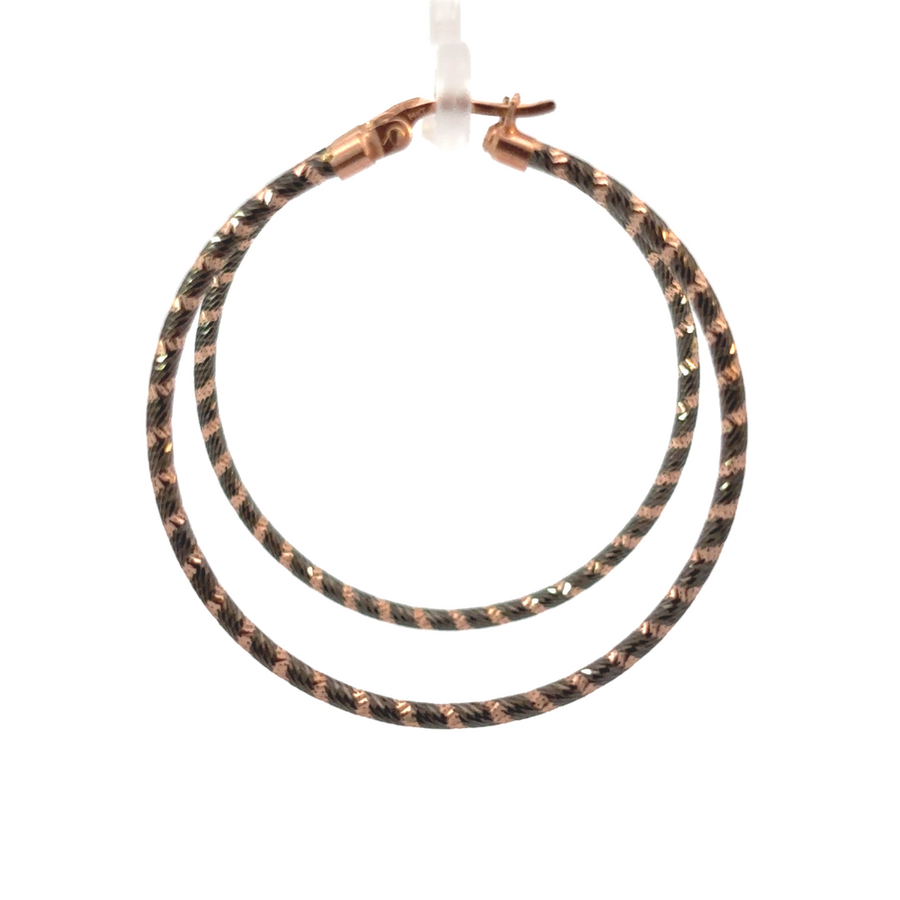 Close-up of modern black and gold drop earrings