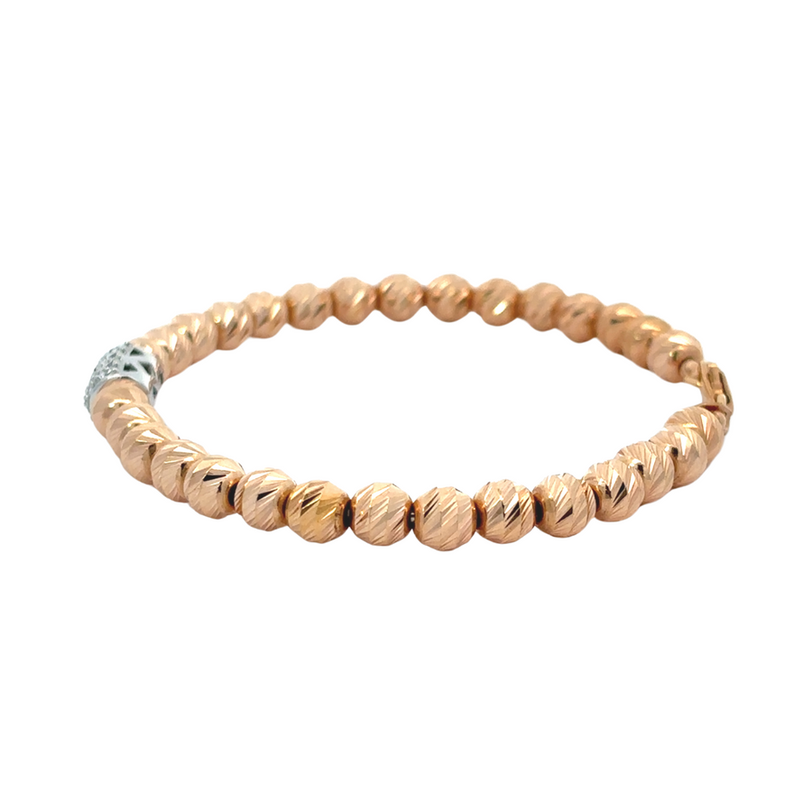 Elegant women’s bracelet featuring woven rose gold and diamonds