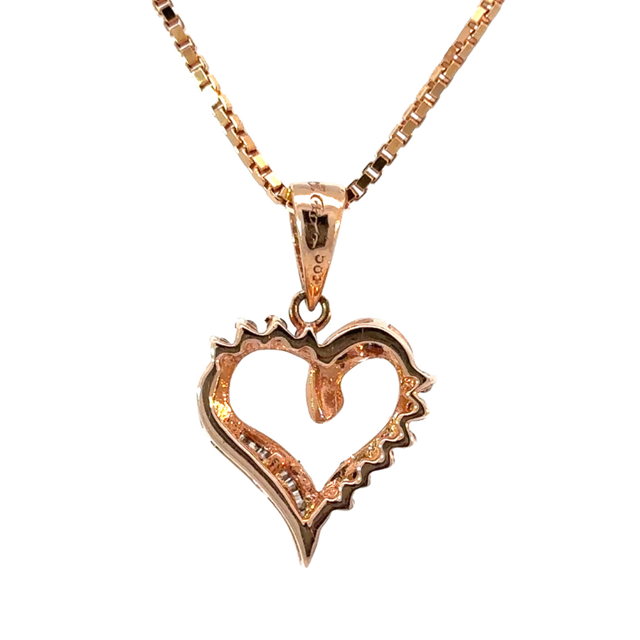 Diamond-studded heart pendant in warm rose gold