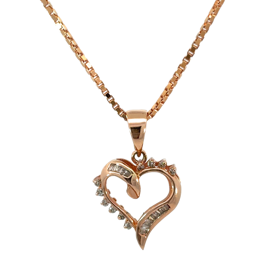 Close-up of rose gold heart pendant with sparkling diamonds
