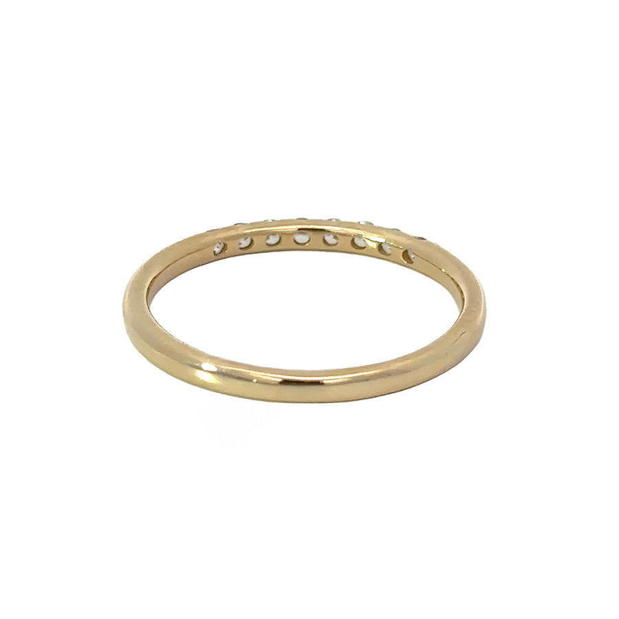 Close-up of 14k gold band with CZ centerpiece for women