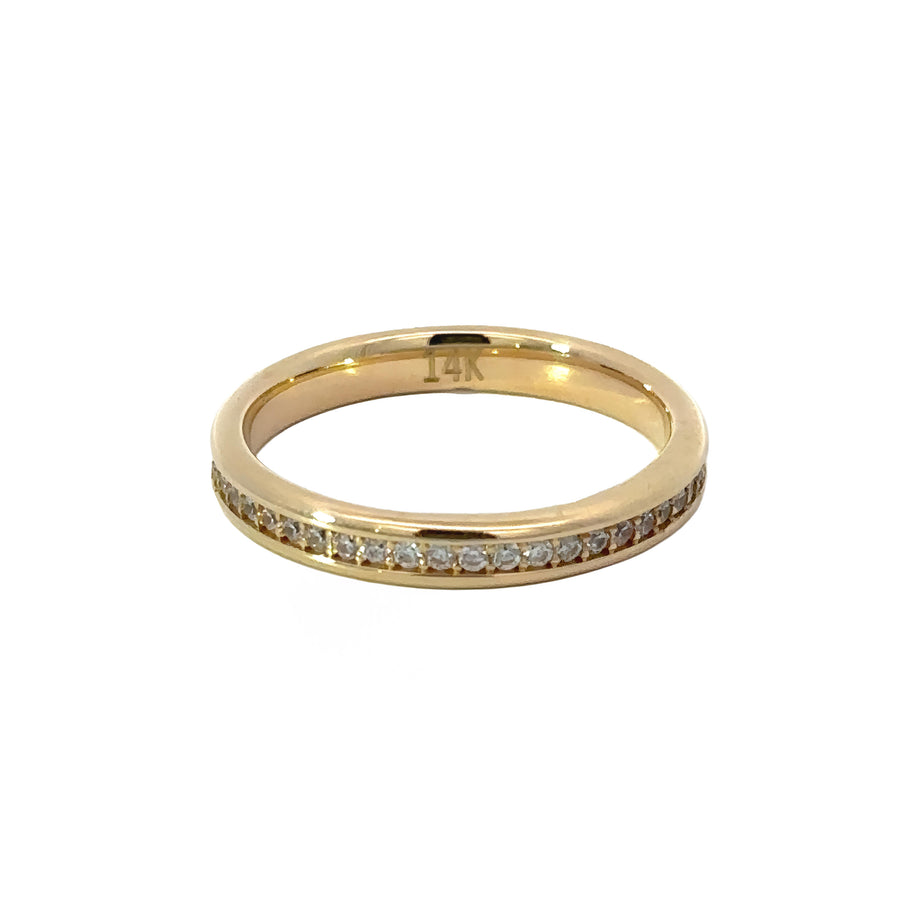 Sparkling CZ gold ring displayed on velvet background