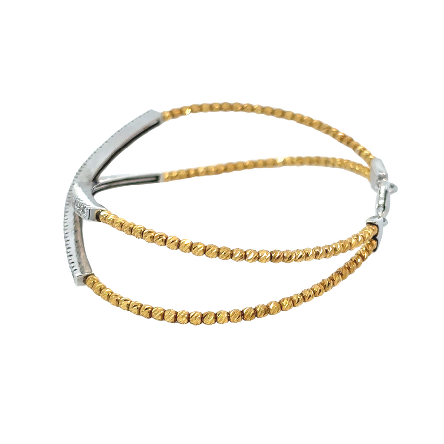 14k gold bracelet with sparkling diamonds on a white background